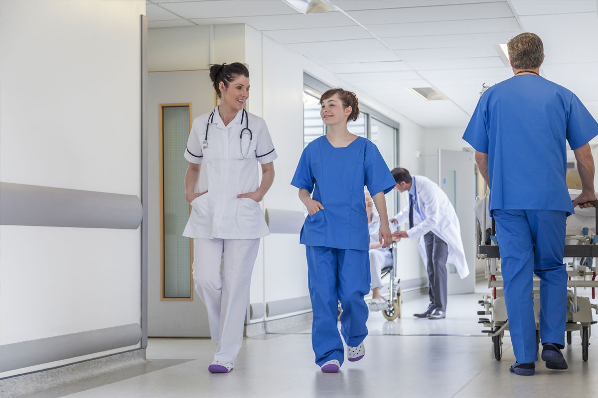 hospital-employees-walking-hallway